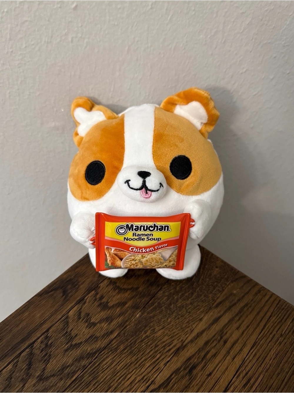 5” Zuru Snackles Benji Corgi plush toy holding a mini Maruchan Ramen Noodle